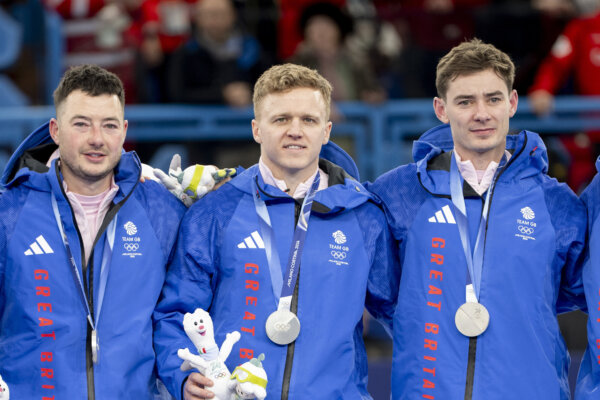 Team GB’s mens team of Bruce Mouat, Grant Hardie, Hammy McMillan JNR & Bobby Lammie receive their silver medals after getting beaten by Canada in the Curling Mens Team event Gold medal Match during Milano Cortina 2026 Winter Olympics 2026.