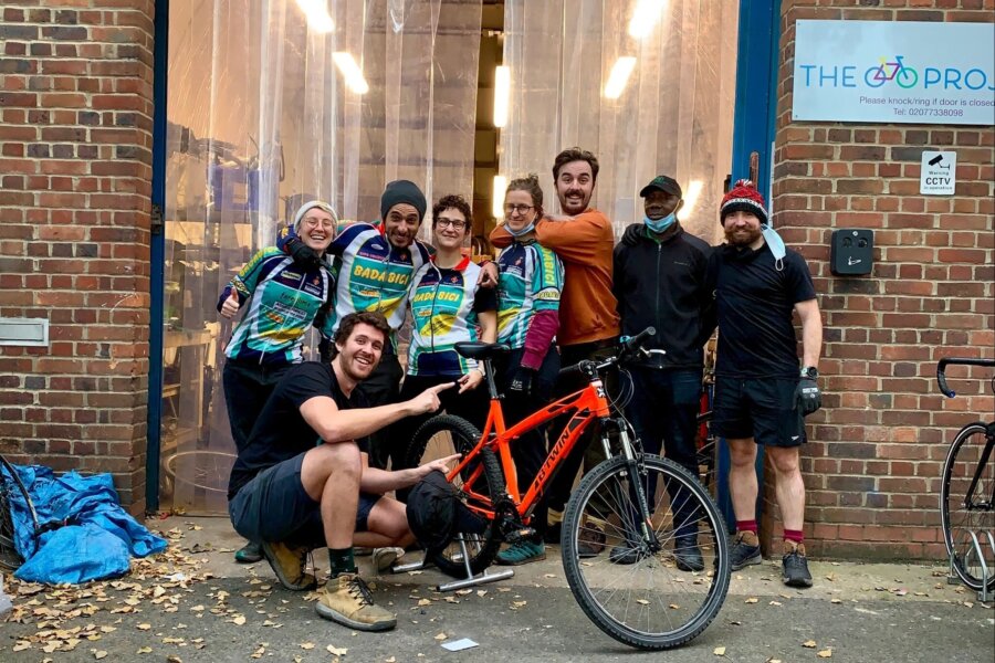 A picture of the group of people from The Bike Project Scotland in front of their offices.