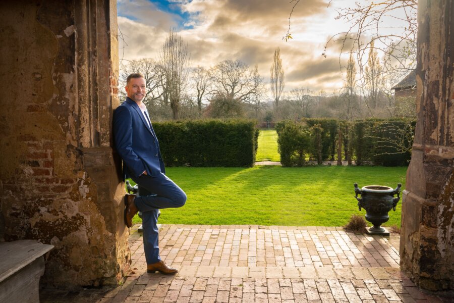A man (Fred Sirieix) in the entrance of one of the Sissinghurst Castle Gardens
