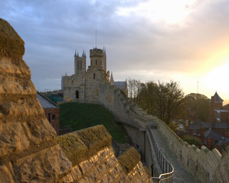 Lincoln Castle pictured from the high walkway around the castle keep, at sunset.