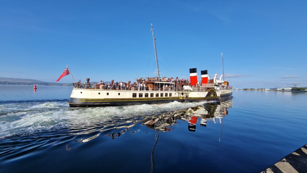 A sea vessel, the Paddle Steamer Waverley, moving through water.