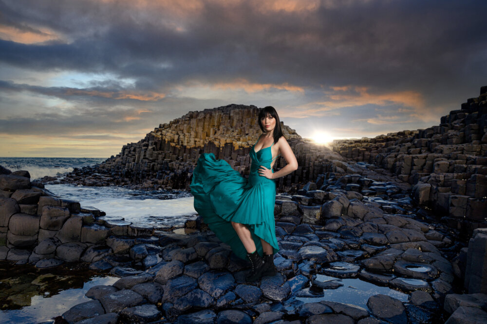 ©Getty Images - 'Imagine A World If...' a woman (Daisy Lowe) with a dress at Giant's Caseway in Northern Ireland.