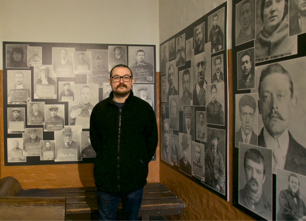 Charlie Southerton, Curator, pictured in one of the atmospheric cells that visitors can experience at Greater Manchester Police Museum