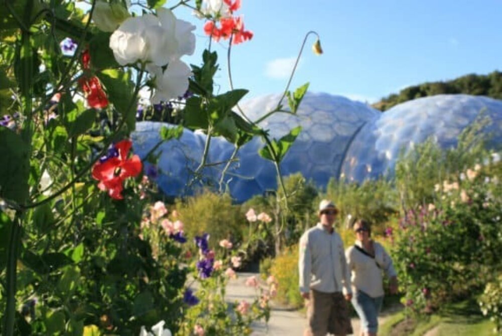 Visitors enjoying Eden Project's domes in summer