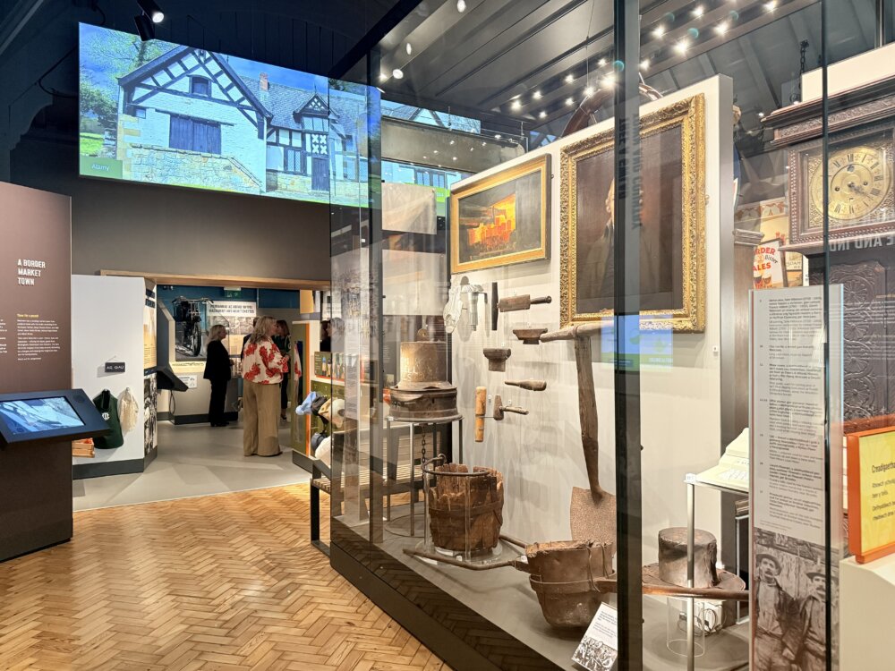 A museum exhibition behind glass.