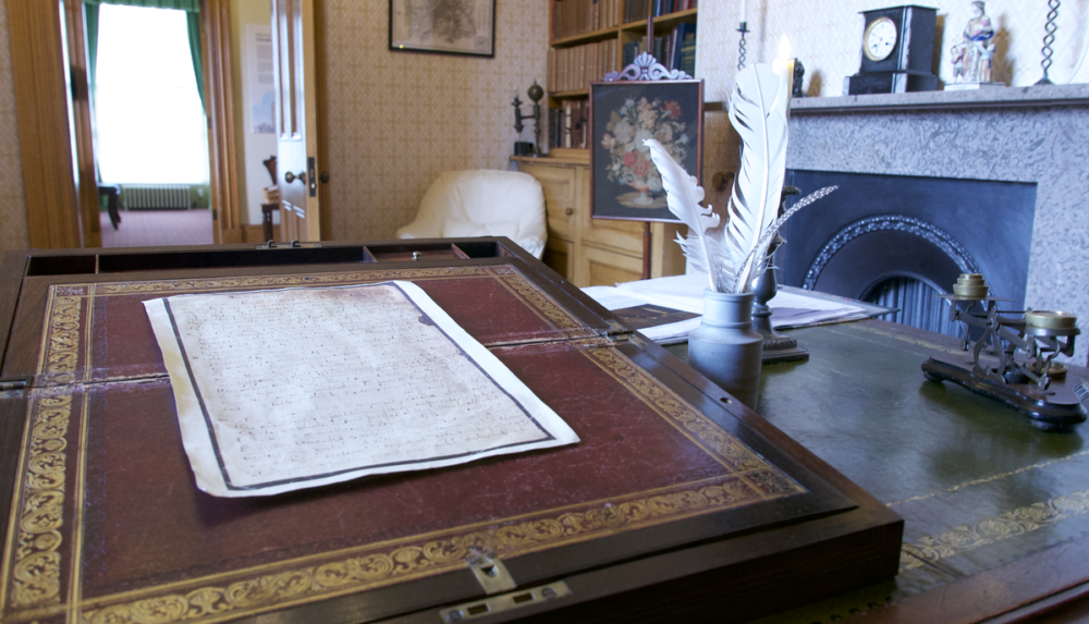 While Elizabeth Gaskell's writings have stood the test of time, a volunteer at Gaskell's House explains that this photo shows teh view from Mr Gaskell's writing desk, a pen and quill to one side.