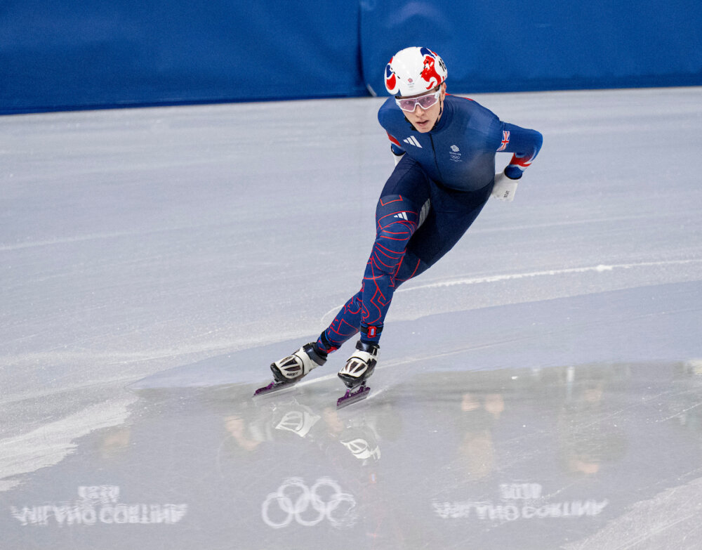 Niall Treacy competing in a short track speed skating race for Team GB.