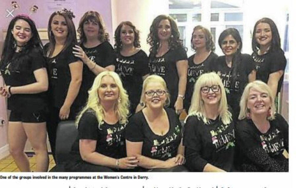 A big group of women from The Women's Centre posing for a picture group, Derry.