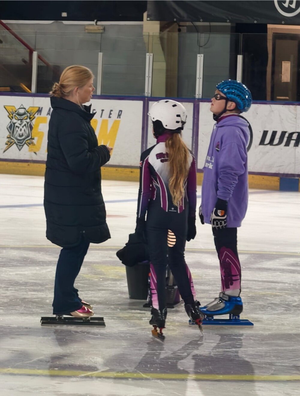 Coach Sally on the ice with young speedsters at Altrincham Speed Skating Club