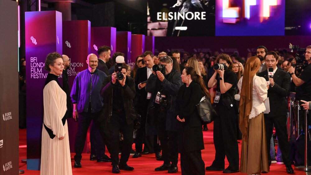 A person is photographed on the red carpet.
