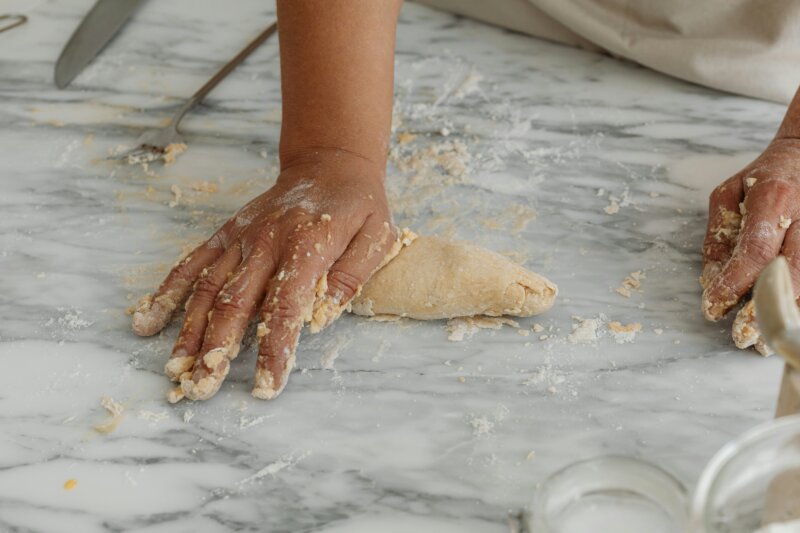 Person kneading on a countertop