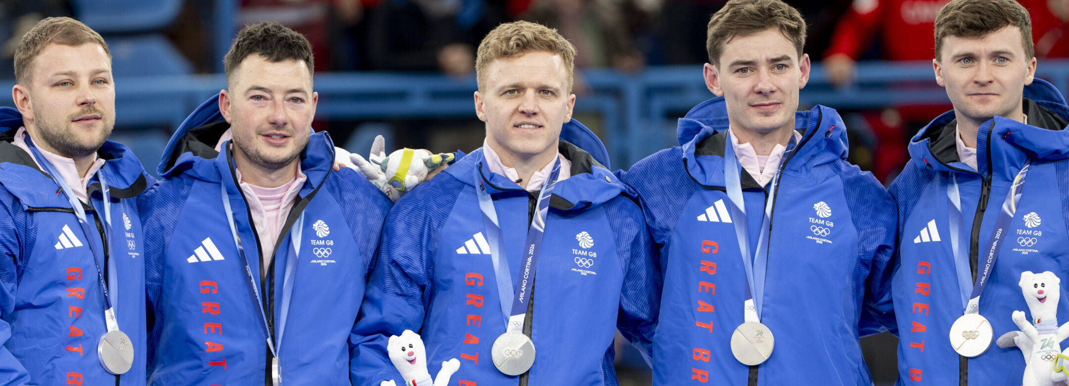 Team GB’s mens team of Bruce Mouat, Grant Hardie, Hammy McMillan JNR & Bobby Lammie receive their silver medals after getting beaten by Canada in the Curling Mens Team event Gold medal Match during Milano Cortina 2026 Winter Olympics 2026.