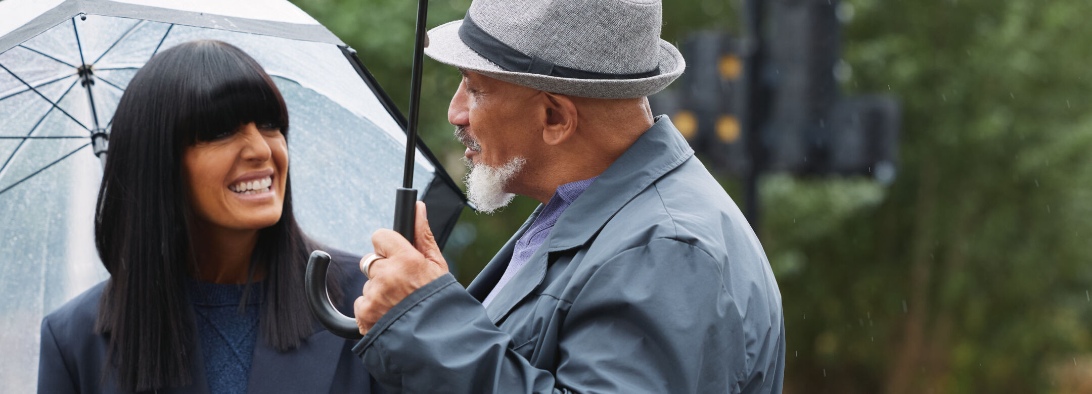 Claudia Winkleman talking to a man outside.