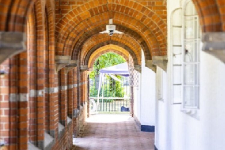 The covered walkway outside the historical 18th century Ashburton Hall building in Croydon