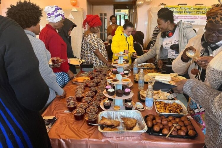 Local community members visiting the Bradford African Community (BAC) Centre during the launch of Engage Project, a community initiative funded by The National Lottery Community Fund-Reaching Communities. The Image captured visitors getting ready for refreshment, engaging with staff and volunteers in welcoming environment, highlighting the positive impact of National Lottery funding in bringing people together promoting inclusion and strengthening community connection.