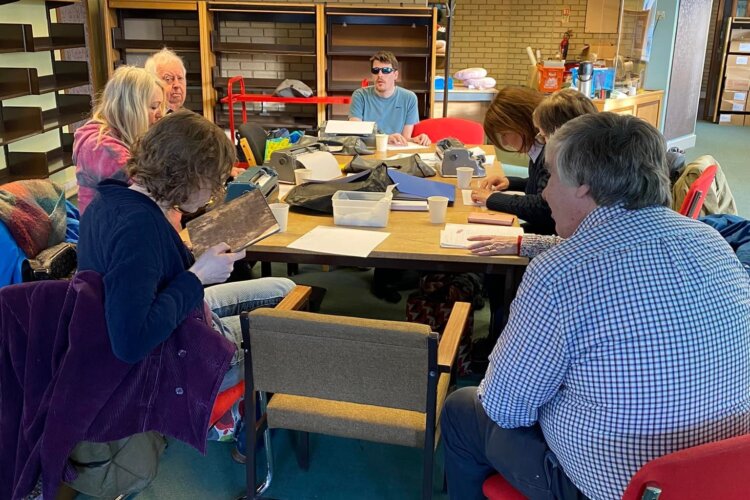 Image of learners using Perkins Braillers and transcribing braille.