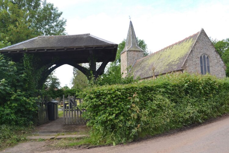 <img src="church-and-lych-gate.jpg" alt="View of St John the Baptist Church through the lych gate">