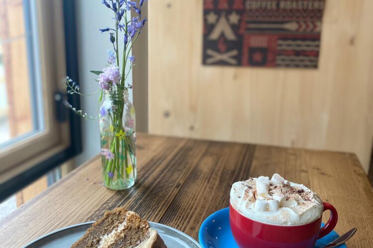 Slice of cake and hot chocolate in An Nead Cafe