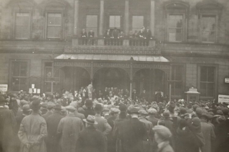 black and white photo of crowds outside Skipton Town Hall c.1930s
