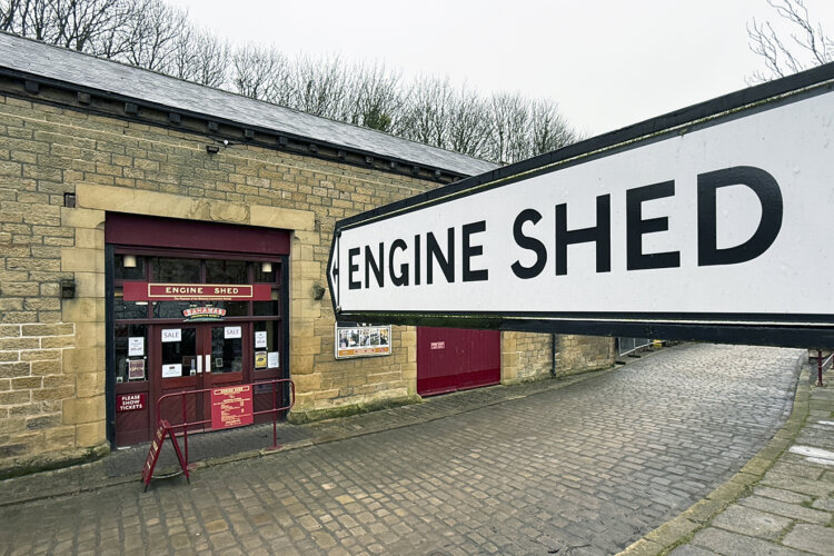 Finger post sign directing towards the entrance of the Engine Shed Musuem of the Bahamas Locomotive Society.