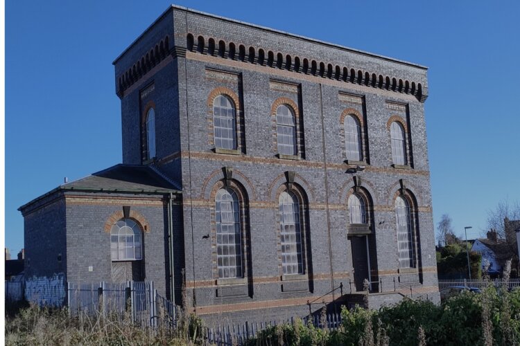 Image of the Victorian blue bricked Pumping Station, with decorative features.