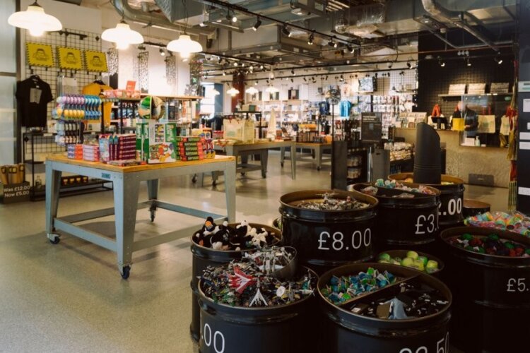 A view through the Science and Industry Museum shop showing displays of gifts, toys and science kits for sale.