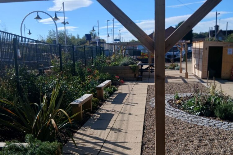 A photo of a garden with a cafe