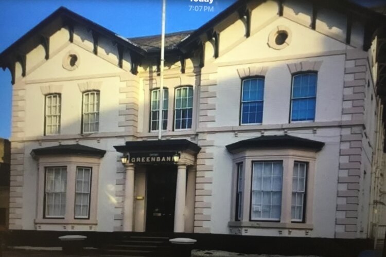The image shows the Greenbank building set in its own grounds.